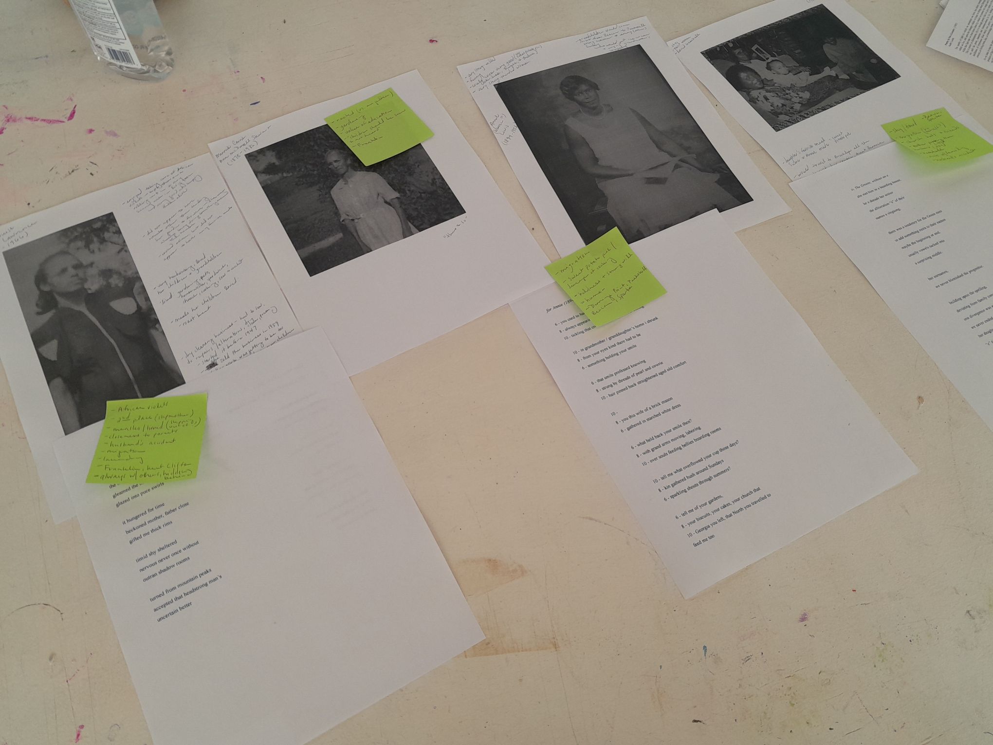 Printed images of the author's four great-grandmothers, sticky notes, and print-outs of poem drafts.